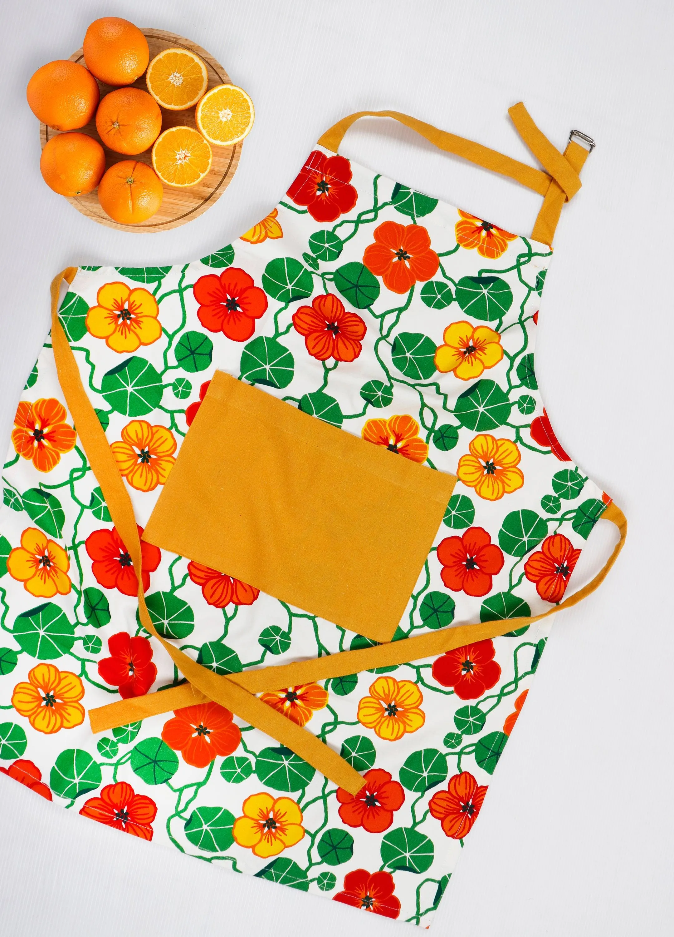 Cotton Green and Orange Flower With Yellow Solid Pocket Free Size Apron Pack Of 1